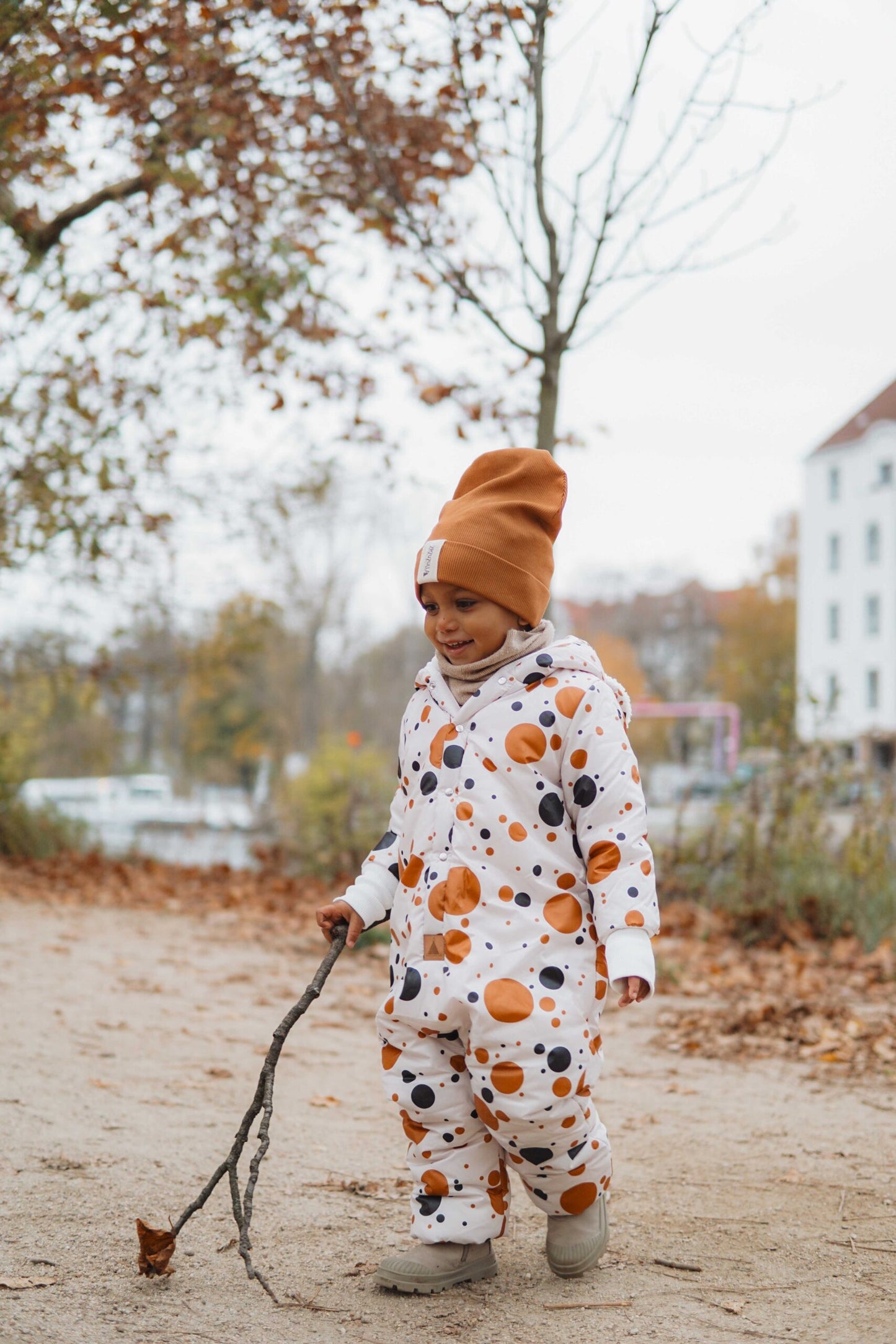 Winter Jumpsuit with Teddy Lining for Babies and Kids - Black and Orange Dots